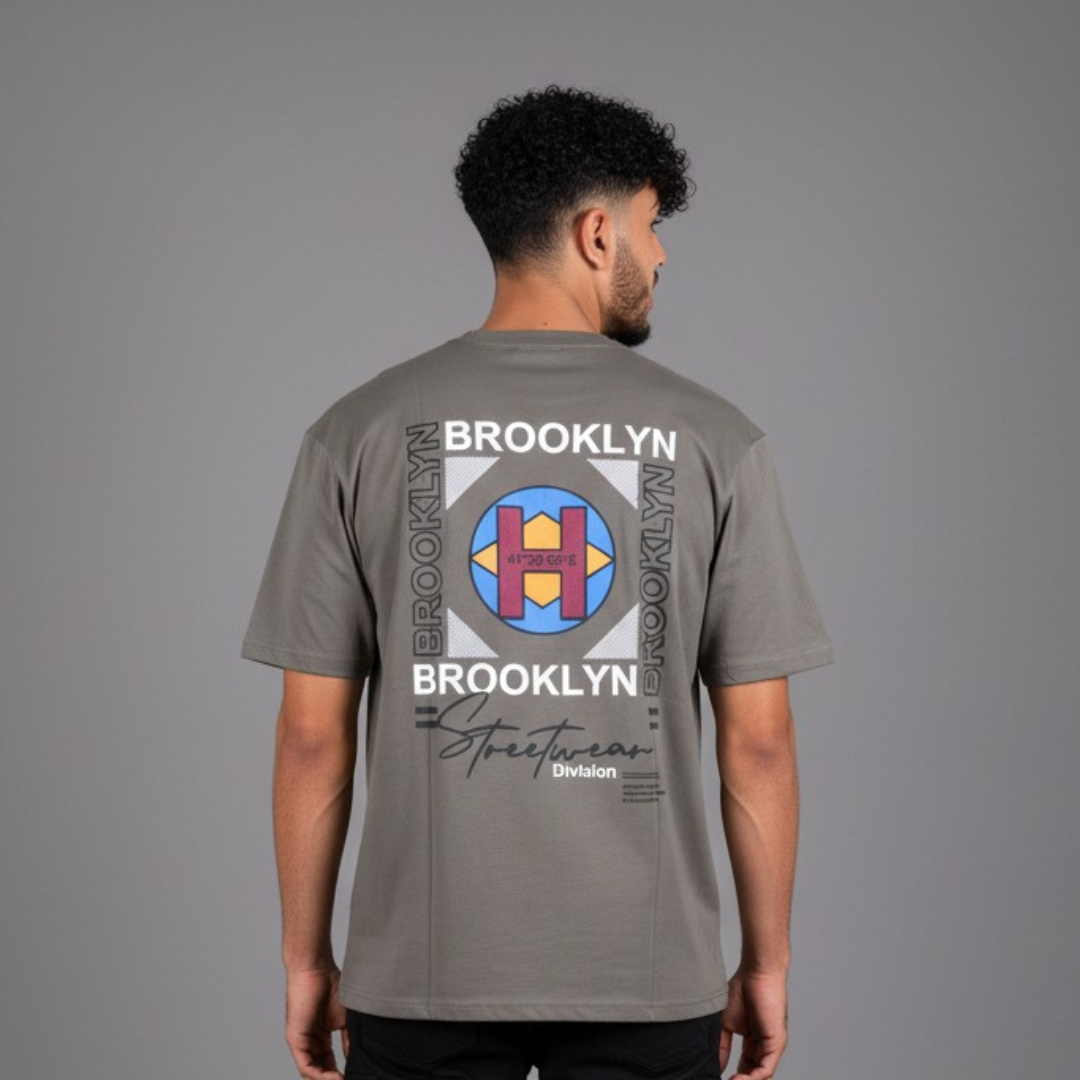 Oversized T-Shirt in grey with a white block graphic and a blue circle on the back