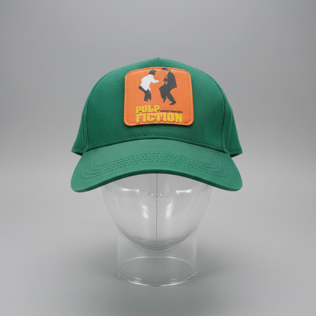 Green cap with a rectangular orange patch of two figures at the front