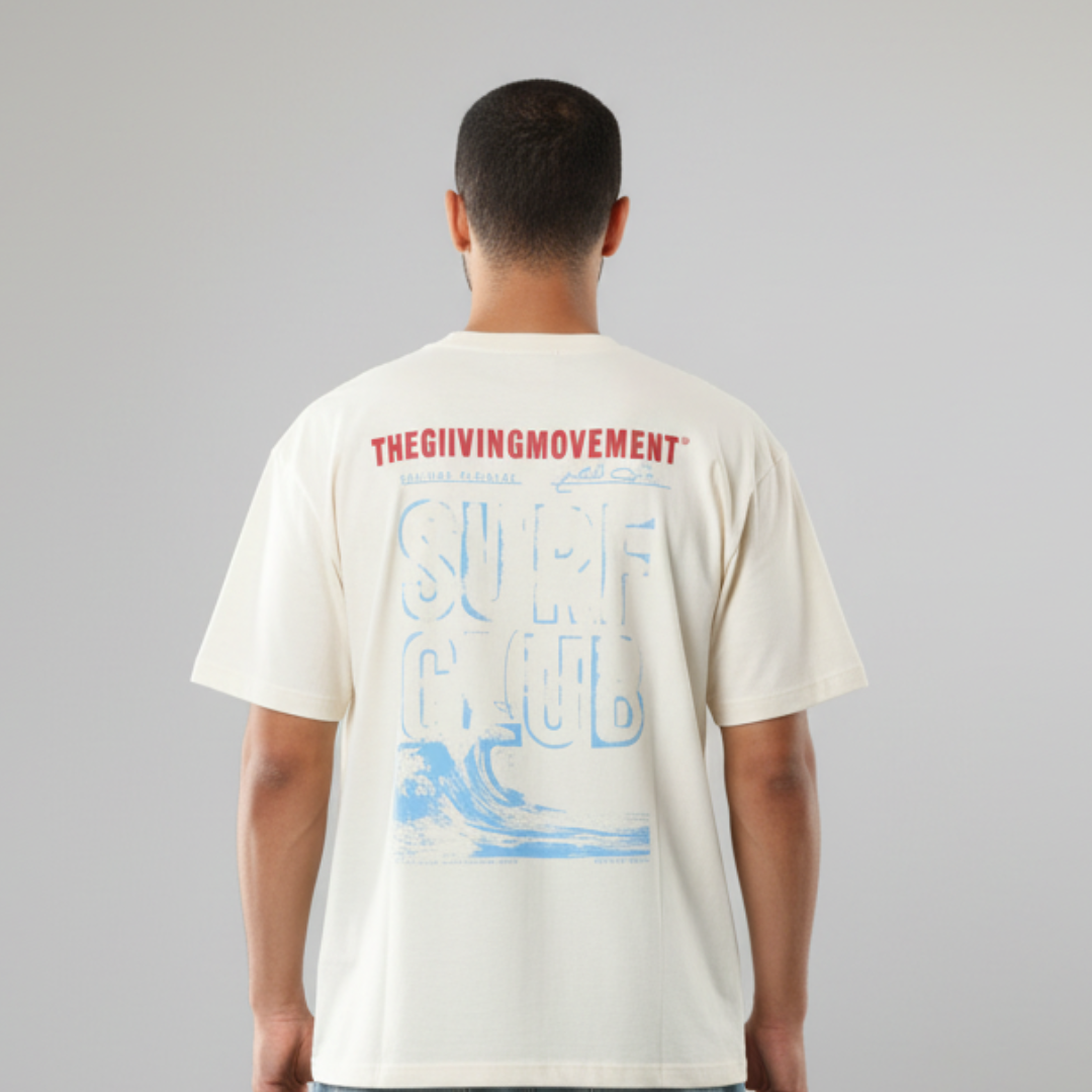 Oversized T-Shirt in cream with a blue wave graphic and red lettering on the back