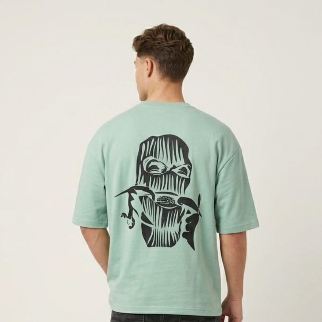 Oversized T-Shirt in mint green with a black face drawing on the back, back view