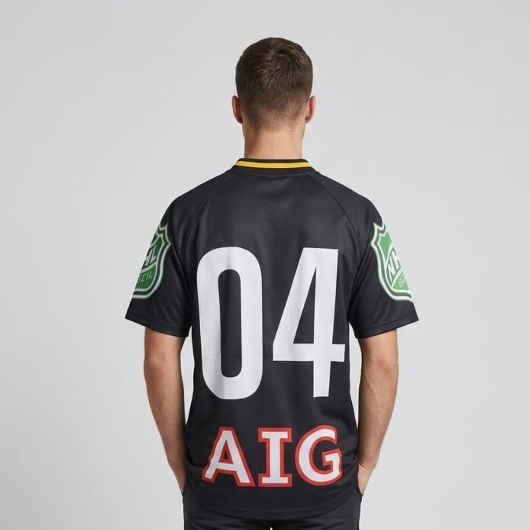 Oversized T-Shirt in black with large white numbers, red outlined letters and green shield badges