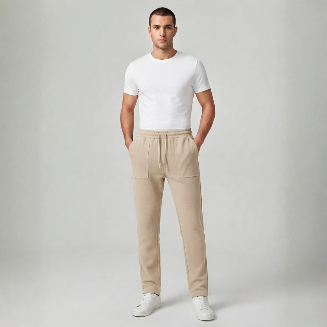 Beige trousers with a waffle texture, front patch pockets and a drawstring waist