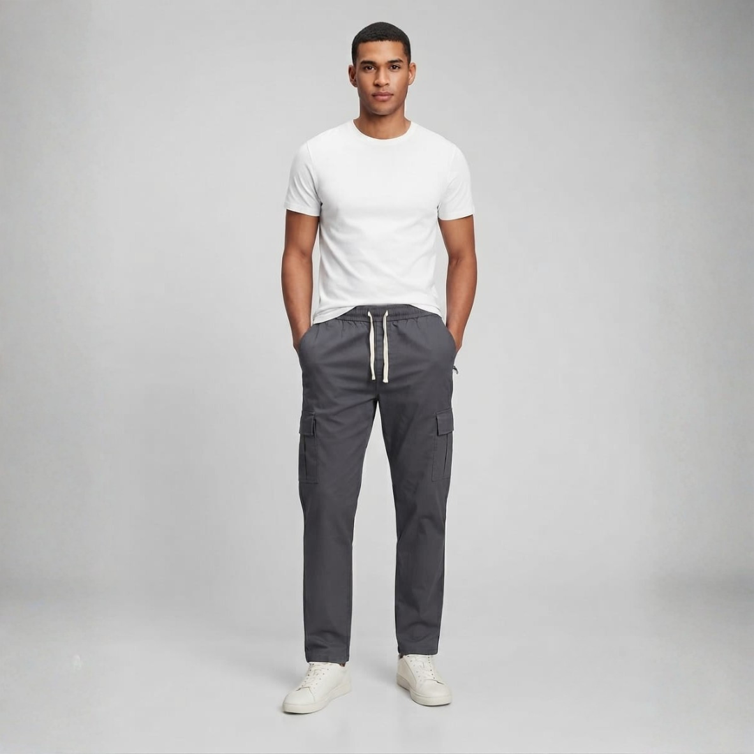 Dark grey cargo trousers with a cream drawstring waist and a flap pocket on each leg