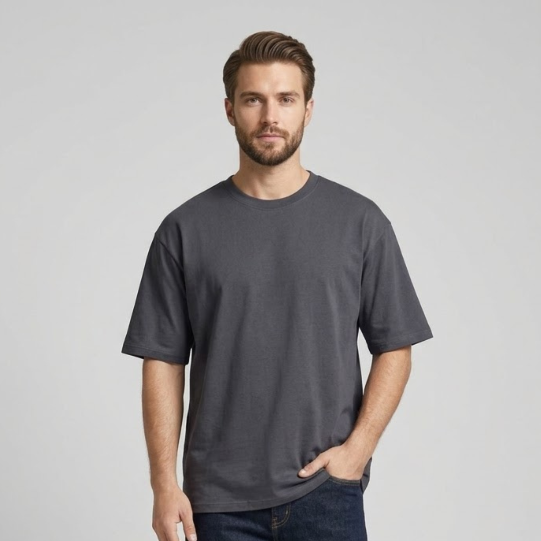 Dark grey T-shirt, Big Size, plain with dropped shoulders and a round neck in the same colour, worn by a person