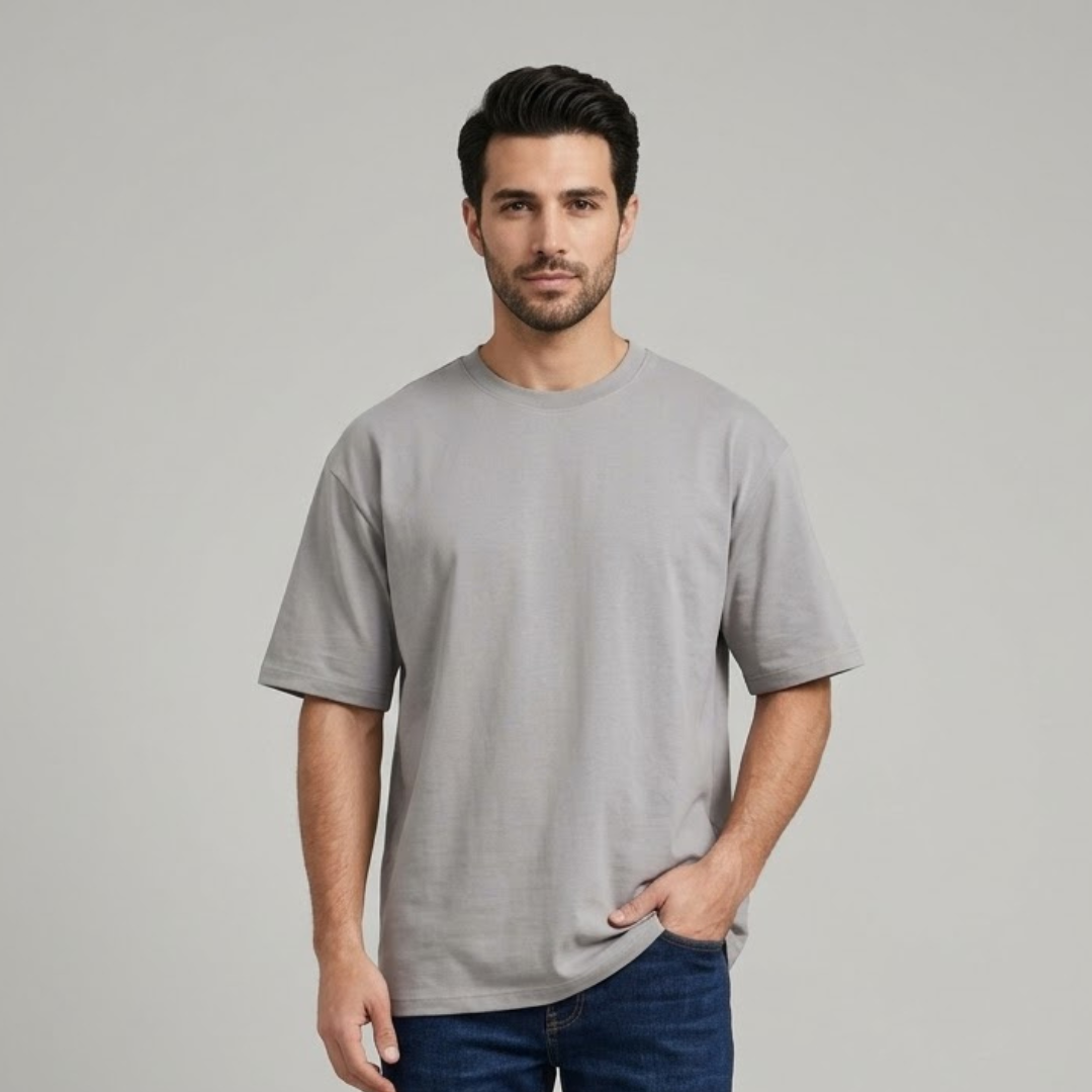 Light grey T-shirt, Big Size, plain with dropped shoulders and a round neck in the same colour, worn by a person
