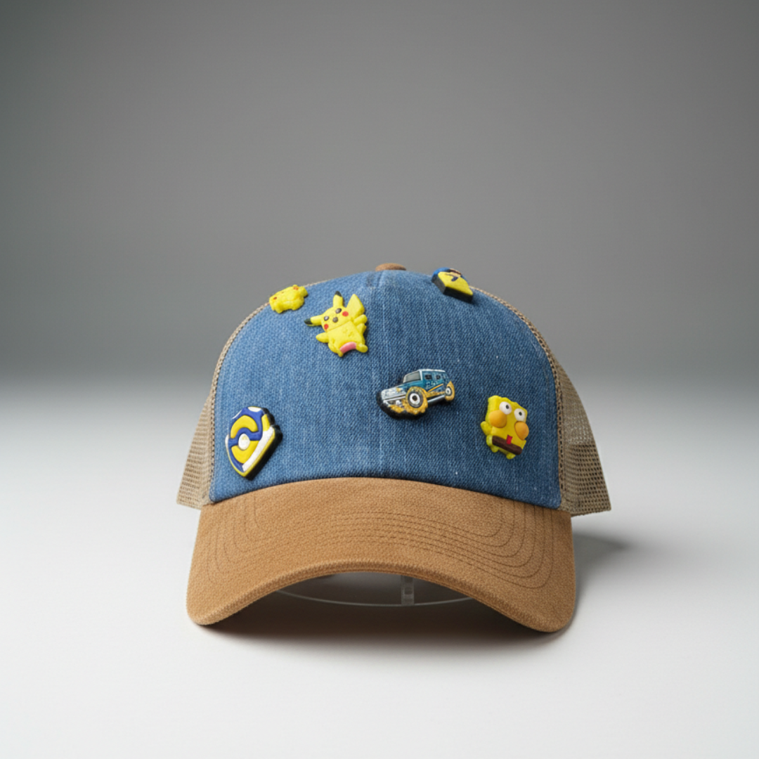 Blue cap with a tan peak and removable rubber charms at the front