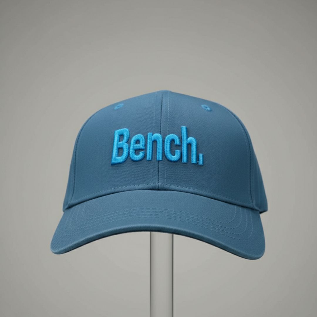 Blue cap with raised lettering at the front and a curved peak
