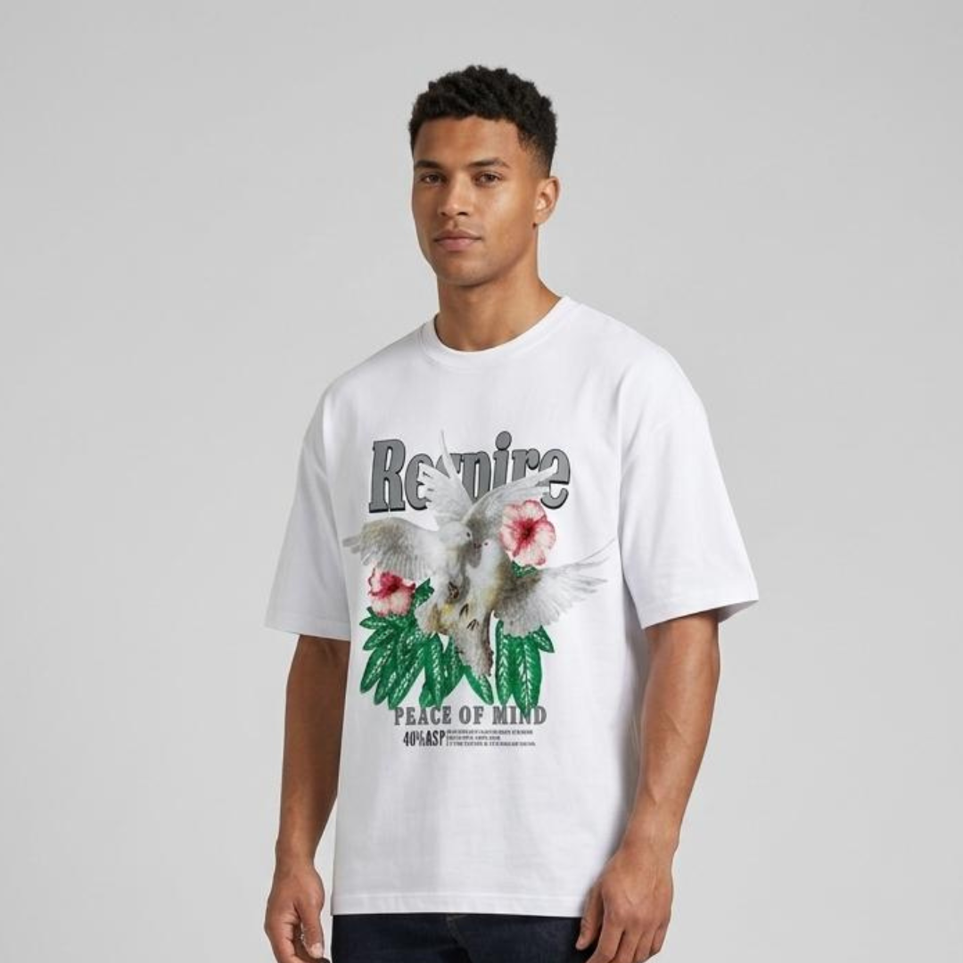 White t-shirt with a chest print of two white birds, pink flowers, green leaves and arched lettering