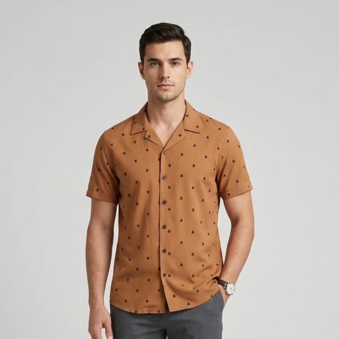 Man wearing a ginger brown beach shirt with a small dark print, open collar and short sleeves, front view
