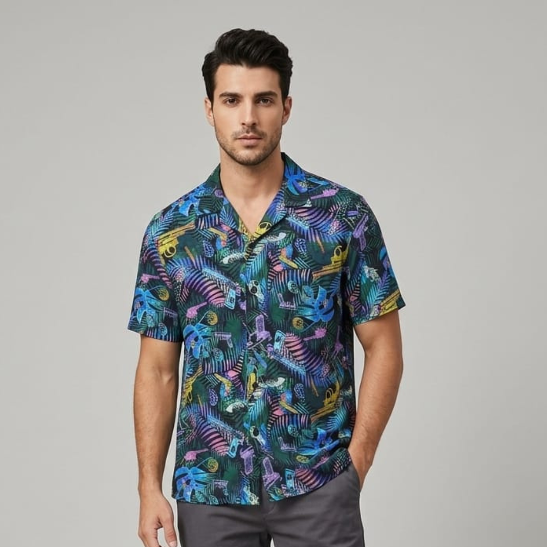 Man wearing a deep green beach shirt with a bright leaf print, open collar and short sleeves, front view