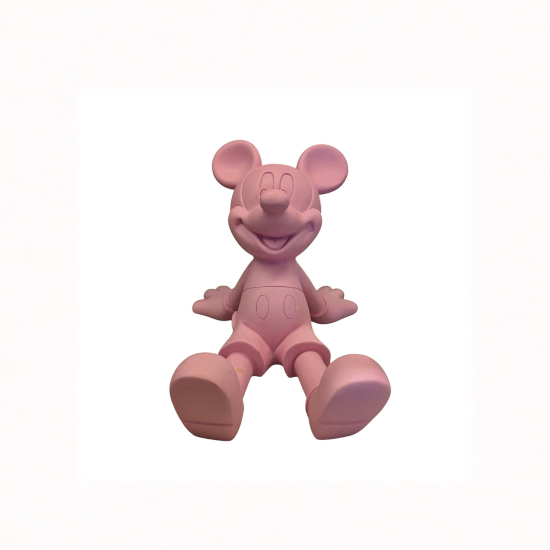 Pink seated cartoon mouse figure phone stand with large round ears and a matte finish