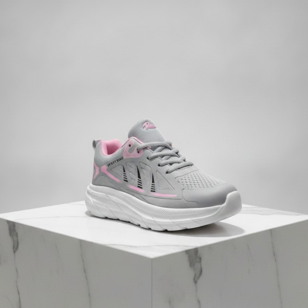 Light grey lace up shoe with a pink lining, pink curved lines and a thick white sole
