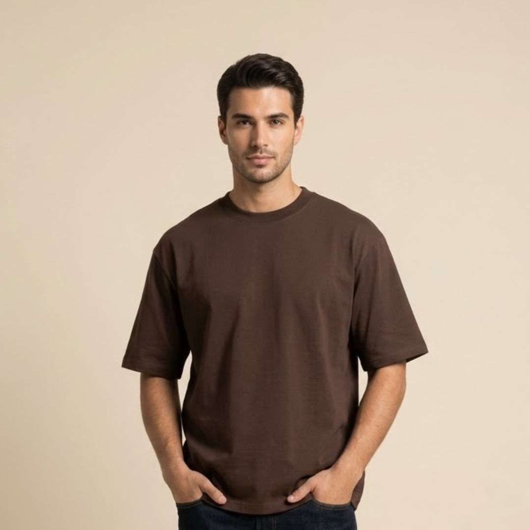 Dark brown T-shirt, Big Size, plain with a round neck in the same colour and dropped shoulders, worn by a person