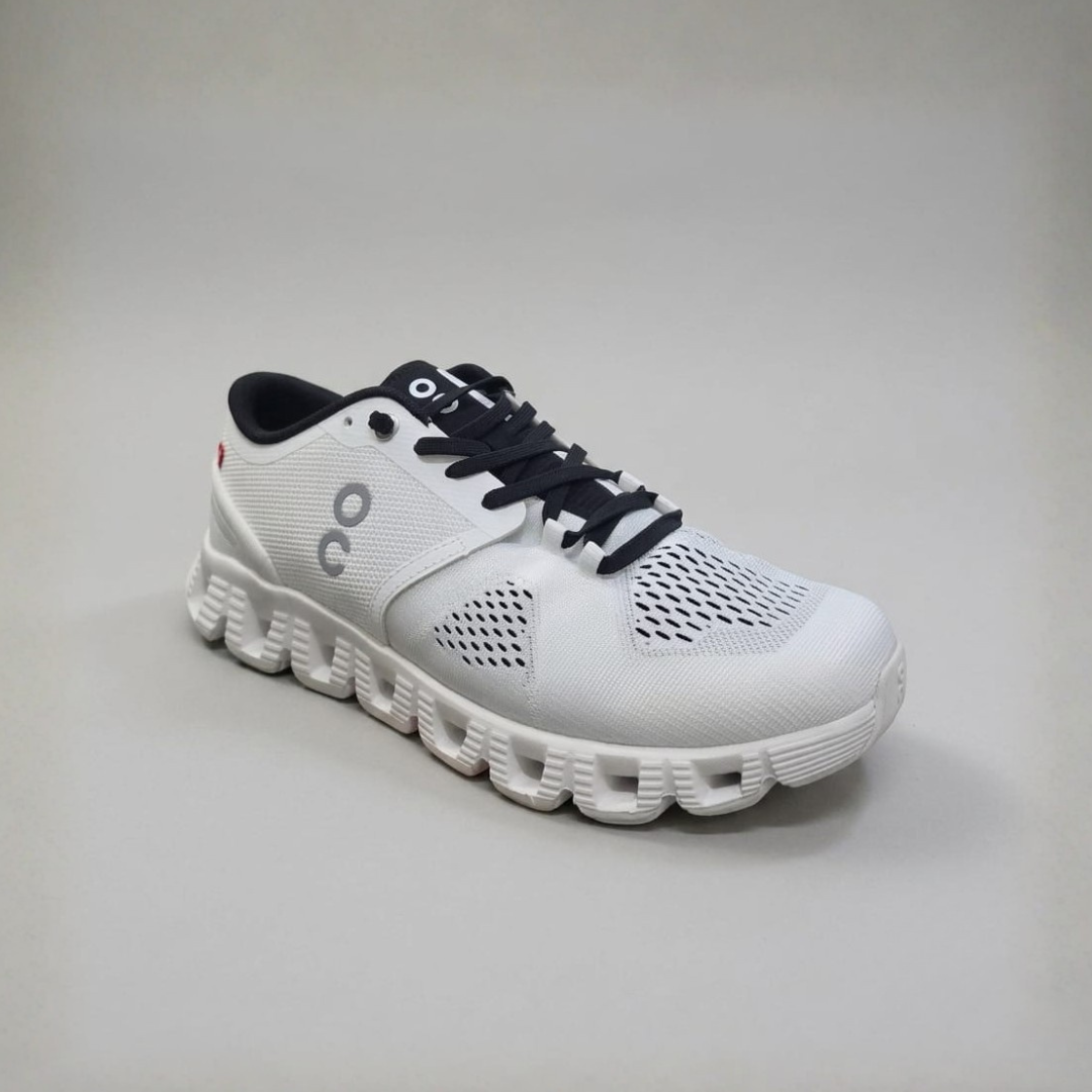 Men Shoes in white with mesh panels, a small side mark, black laces and a thick white sole