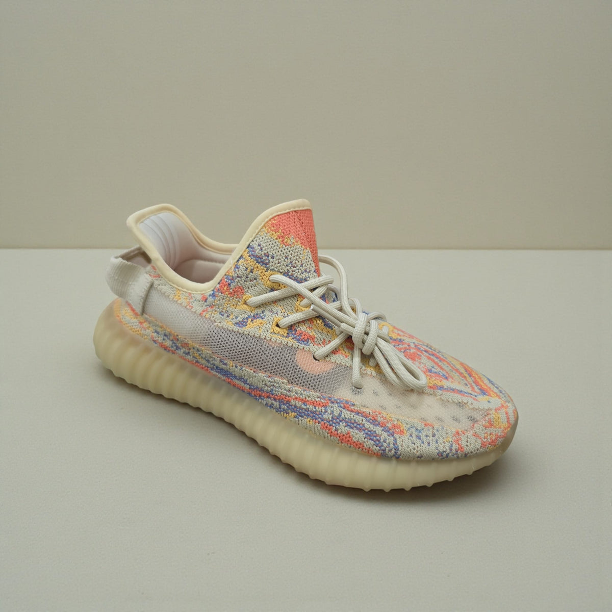 Men Shoes in cream with a knitted upper in orange, blue and yellow lines and a thick ribbed sole